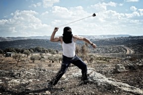 Palestinian man fight against the Israel Defense Forces in Bil'in